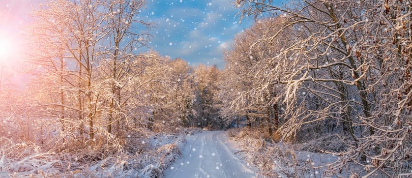 Beautiful view of the sunrise in the morning on the country snowy road. Scenery landscape.