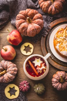 Herbal tea with fruits and cinnamon with apple pie for Thanksgiving.