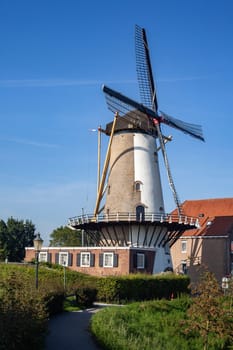 Windmill farm river landscape. Windmill farm scene. Village windmill farm river. Windmill farm river view