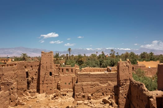 old kasbahs and high Atlas mountains in background, Tinghir, Morocco in north Africa