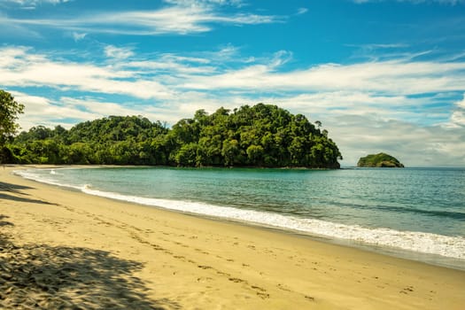 Playa in Manuel Antonio National Park, Costa Rica wildlife. Pacific ocean. Picturesque paradise tropical landscape. Pura Vida concept, travel to exotic tropical country.