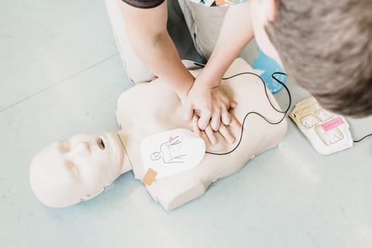 First aid cardiopulmonary resuscitation course using automated external defibrillator device, AED.
