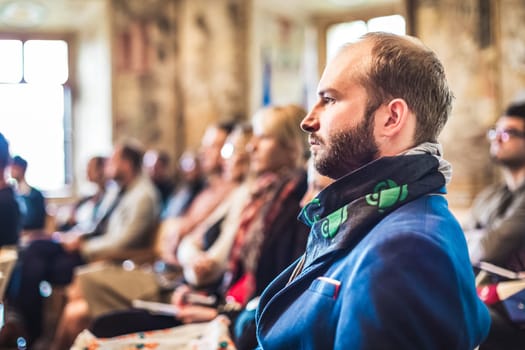 Presentation at Business Conference. Entrepreneurs in the audience at the conference hall.