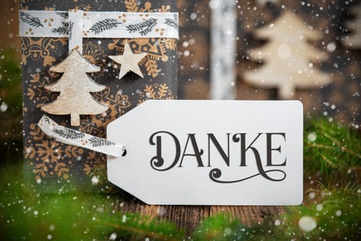 German Text Danke, Means Thanks In English, On A Label, Christmas Gifts, Eco Friendly Winter Decor With Snowfall