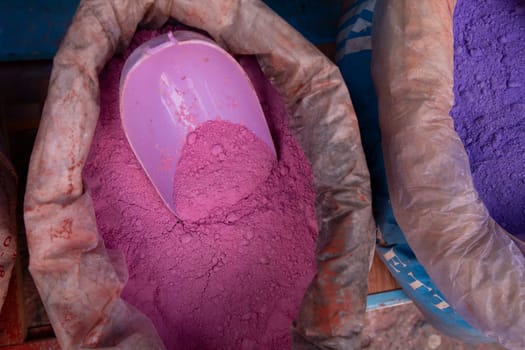 Close up sack with paint pigment in different colors for sale in a Moroccan street market. Chefchaouen