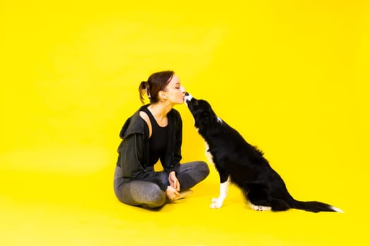 Friendship between people and animals, a studio shot, love, tender, warm feeling and emotion