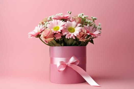 Flowers in a round luxury gift box. Bouquet of pink and white flowers in a paper box. Mockup of a hat box with flowers in pastel colors with free space for text.