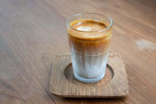 Dirty coffee on wooden table, stock photo
