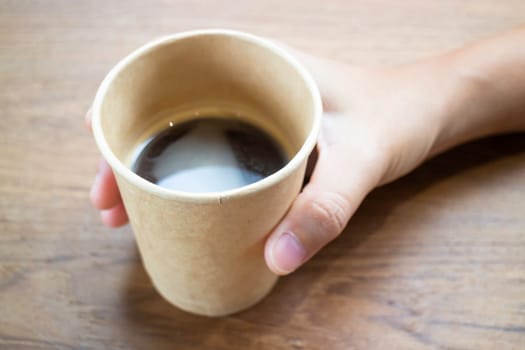 Disposable cup of hot black coffee, stock photo