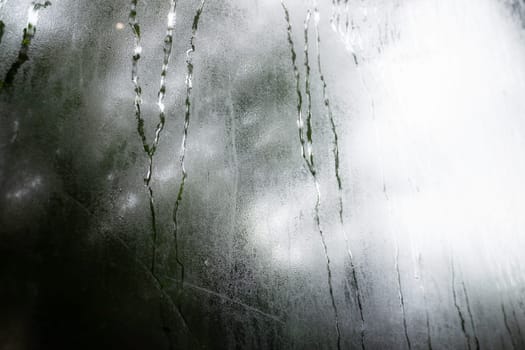 Looking at the rain through the window, stock photo