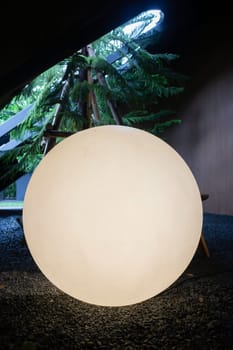 A bright glowing matte white burning round light bulb, stock photo