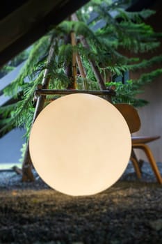 A bright glowing matte white burning round light bulb, stock photo