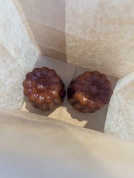 Fresh homemade caneles french pastry, stock photo