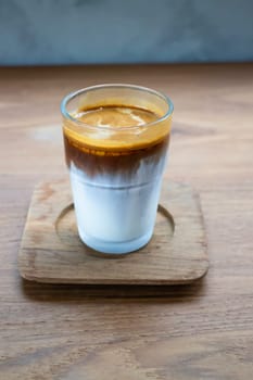 Dirty coffee on wooden table, stock photo