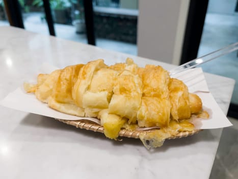 French breakfast with pastries at work from home, stock photo