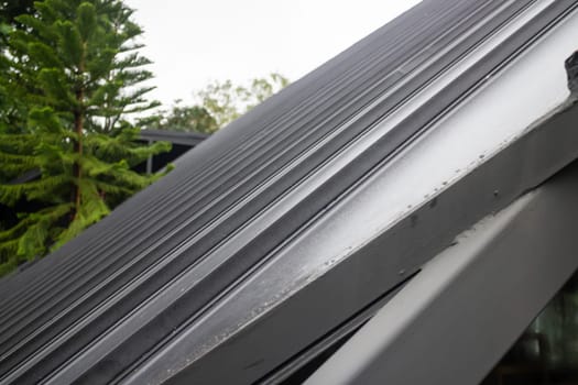 House exterior style with black roof tiles, stock photo