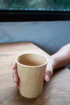 Disposable cup of hot black coffee, stock photo