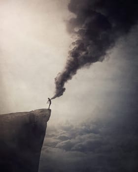 Deliver from evil conceptual scene with a person on the edge of a cliff liberates a dark smoke out of his chest as relieve his body and mind from fears, stress and negative emotions