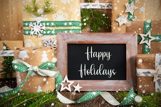 Text Happy Holidays On A Chalkboard With Sustainable Winter Decoration, Green, Eco-Friendly Christmas Background