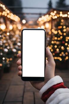 A hand holds a black smartphone with a blank screen on a Christmas background.copy space,mockup.Generative AI