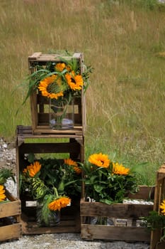 A festive decoration with beautiful yellow sunflowers.