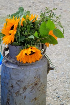 A festive decoration with beautiful yellow sunflowers.