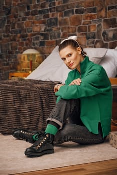 Cute woman having rest in her forest house during winter holidays