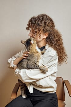 Tabby cat kisses his cute owner