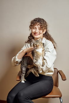 Portrait of happy woman with her cute kitten