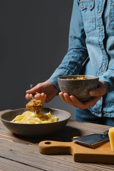 Unrecognizable woman put vegetable sauce in plate with pasta