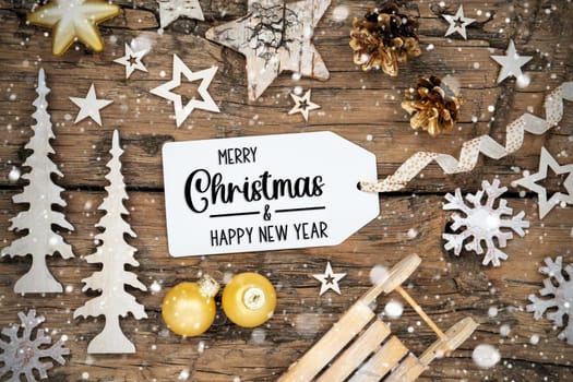 Rustic Wooden And Golden Christmas Background, Christmas Decor With Snowfall And Label With Text Merry Christmas And Happy New Year