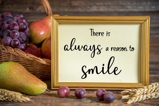 Fall Decoration with Pears, Apples and Grapes, Thanksgiving Background, Autumn Season and Text There Is Always A Reason To Smile