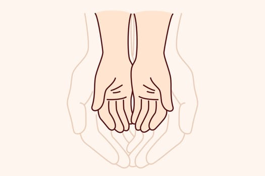 Hands of adult and child symbolize unity of different generations and care for children. Touching comparison of size of hands of father and son experiencing affection or trust in family