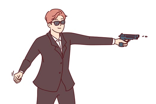 Man secret agent shoots gun, dressed in formal suit and sunglasses for covert operations. Secret agent guy works for special services or CIA, performing especially dangerous tasks national importance