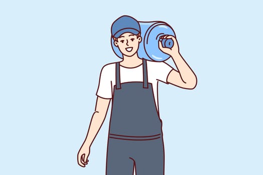 Bottle of water for cooler on shoulder of male loader delivering drinking aqua to offices. Guy courier in cap and work overalls works in delivery service of artesian water for cooler