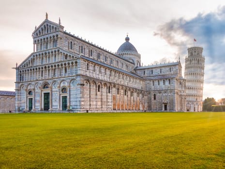Pisa, Italy - 29 June 2023: cathedral sightseeing, travel destination, sunrise light, famous artistic building