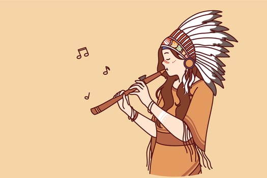 Injun or shaman woman playing flute, dressed in ethnic attire and headdress with feathers. Young girl participates in native american band and performs traditional injun song on musical instrument.
