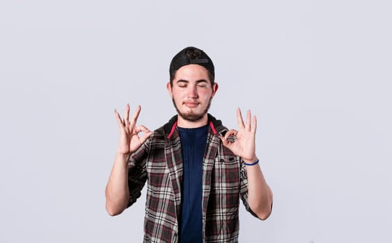 Concept of no problem, young man making ok gesture, expression of everything is fine.