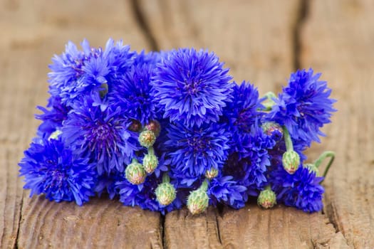 cornflowers on wooden background
