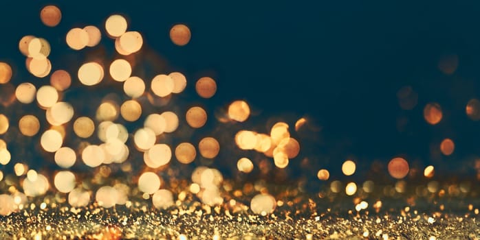 Abstract blur golden glitter border on black background. Luxury card design for new year, christmas and holiday celebration. Party bokeh sparkle confetti textured layout. Classy elegant banner.
