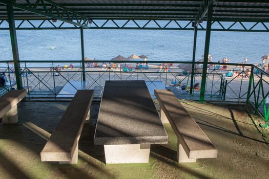 Orellana, Spain - August 4th, 2023: Costa Dulce de Orellana, unique inland beach in Spain awarded with the Blue Flag, Badajoz, Spain. Roofed picnic area