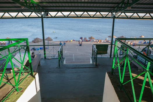 Orellana, Spain - August 4th, 2023: Costa Dulce de Orellana, unique inland beach in Spain awarded with the Blue Flag, Badajoz, Spain. Roofed picnic area