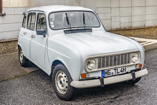 WETTENBERG, HESSE, GERMANY - 07 - 28 - 2023: RENAULT R 4 - French Renault 4 small car in white from the seventies and eighties on a traditional Car Show Golden Oldies in Krofdorf-Gleiberg near Giessen, Hesse.