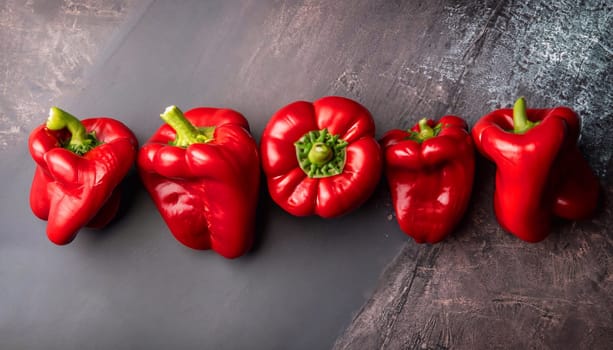Sweet red and yellow peppers, whole top view dark background, with space to copy text.