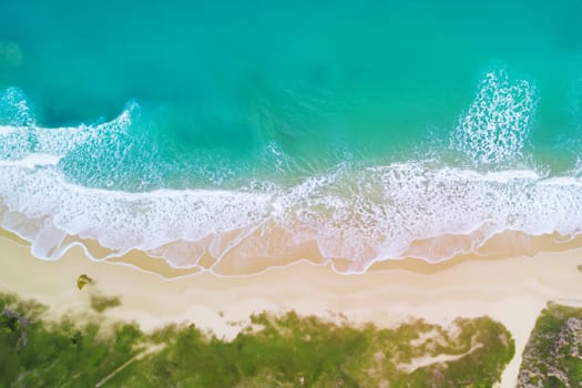 Aerial view of sandy beach and ocean with waves