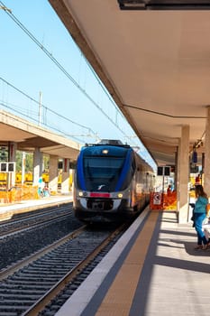 MILAZZO, SICILY, Italy - 03 October 2023. A Trenitalia train arriving at Milazzo station for onward journey to Palermo Central.