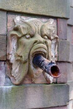 part of the historical fountain at stortorget square in stockholm, sweden.