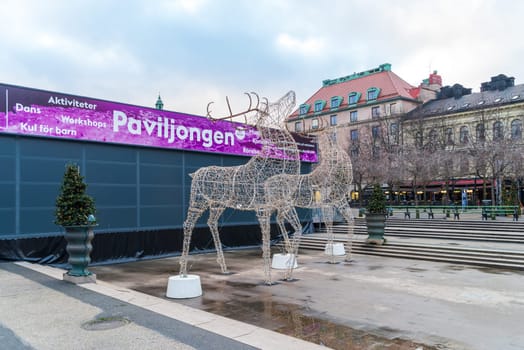 STOCKHOLM, SWEDEN- DECEMBER 23, 2020:  Two enormous deer made of christmas lights in central stockholm