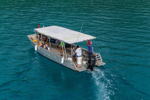 Nadi, Fiji - 24 May, 2023: Group of tourists on a ship in the coast of Nadi, Fiji Islands