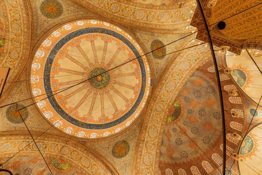 Istanbul, Turkey - June 05, 2023: View of interior geometric painting at the ceiling of Blue Mosque or Sultan Ahmed Mosque in Istanbul, Turkey.